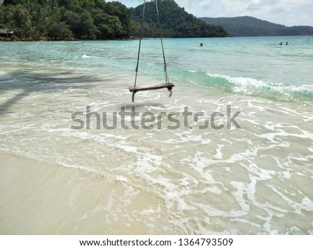 Hanging swings by the beach