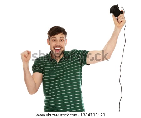 Emotional man playing video games with controller isolated on white