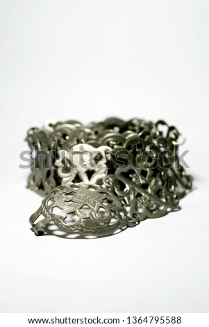 Isolate photo of ancient silver belt on white background with space for write wording, value woman accessories of Thai old generation woman more than 50 years ago. Beautiful unique style handcraft
