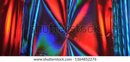 Photo of blurred holographic foil texture.