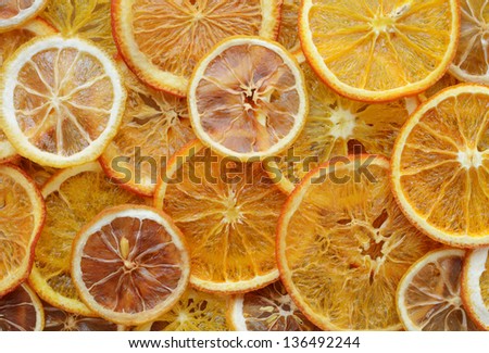 Dried orange and lemon slices background Royalty-Free Stock Photo #136492244