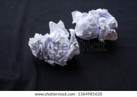 crumpled paper on black background,dirty paper ball