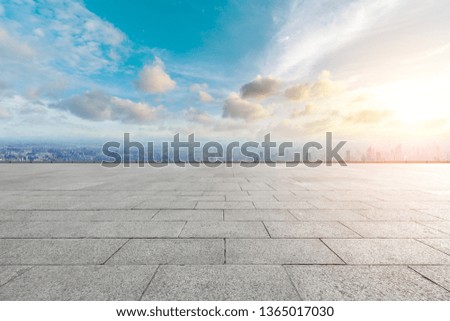 Shanghai city skyline and empty square floor with beautiful clouds at sunset,high angle view