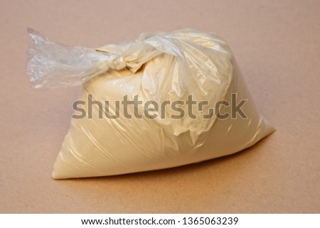 Malt extract inside a plastic packet which is used to make beer at home. Homebrewing ingredients concept image. 