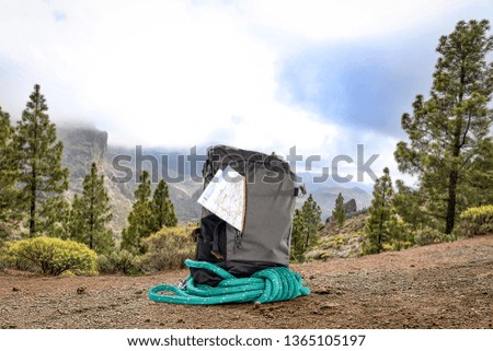 Summer photo of backpack in mountains and free space for your decoration. 