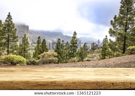 Wooden desk space and summer mountains landscape on Gran Canaria. 