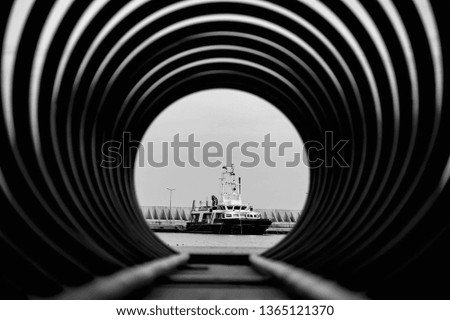 black and white photo in abstract retro style of sea ship that stands at the pier