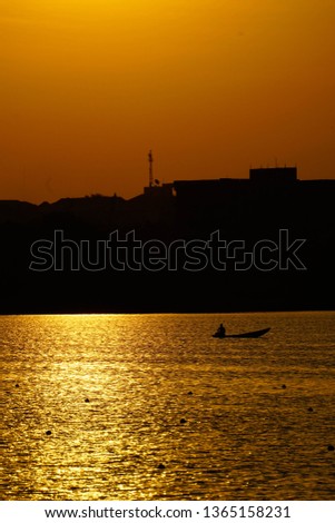 Boat on Lake at Sunrise 