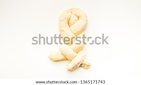 Step by step visual instructions of of braiding a challah bread