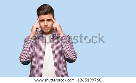 Young cool man doing a concentration gesture
