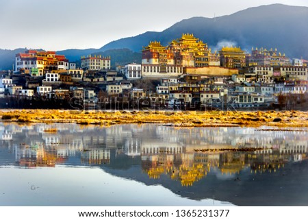  Songzanlin Temple also known as the Ganden Sumtseling Monastery, is a Tibetan Buddhist monastery in Zhongdian city( Shangri-La), Yunnan province, China, Foggy morning, blurred background Royalty-Free Stock Photo #1365231377