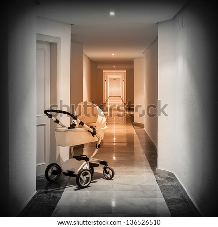 Baby cart in corridor of apartments starting a long way
