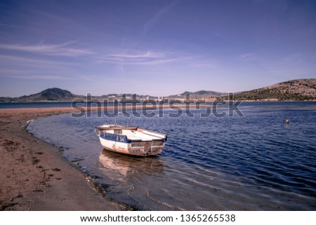 Old boat in Mar Menor with a clear sky (Murcia, Spain)