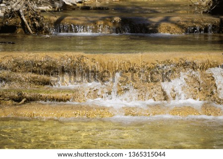 the river flows in the mountains in spring