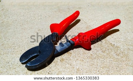 
Pliers, pasatizhi, pincers with red handles for building Royalty-Free Stock Photo #1365330383