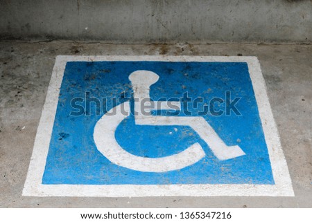 Handicap parking symbol on the road.