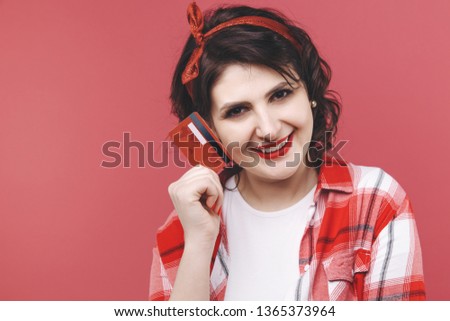 Picture of a girl holding blue credit card