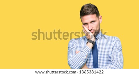 Handsome business man wearing tie thinking looking tired and bored with depression problems with crossed arms.