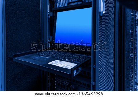 Keyboard Video Mouse KVM Switch in server rack mount Royalty-Free Stock Photo #1365463298