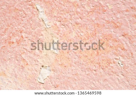 Old colorful flaking whitewashed wall closeup
