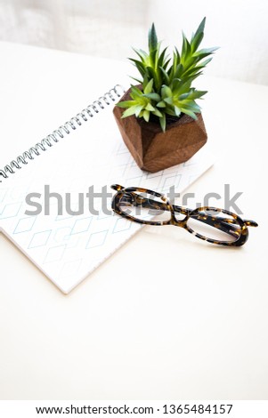 Work Desk with Notebook and Glasses