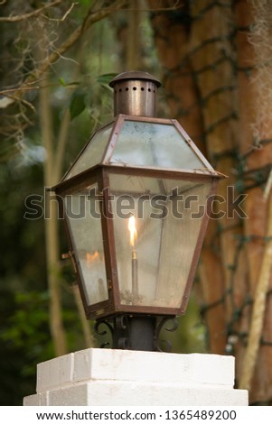 Upscale Luxury Outdoor Mounted to columnvPatio Classic Lantern Lighting with a burning flame with curb appeal