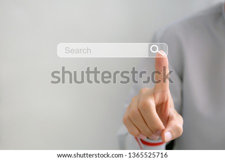 Searching Browsing Internet Data Information Networking Concept,Business man clicking internet search page on computer touch screen,copy space. Royalty-Free Stock Photo #1365525716