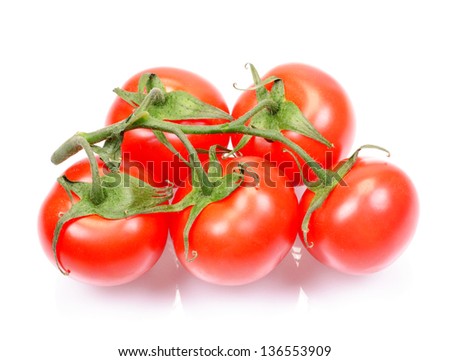 The fresh juicy tomatoes isolated on a white background