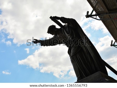 Silhouette sculpture of Christ bearing His cross, Holy Cross Church, Warsaw, Poland