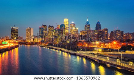 Panoramic picture of Philadelphia skyline and Schuylkill river at night, PA, USA.