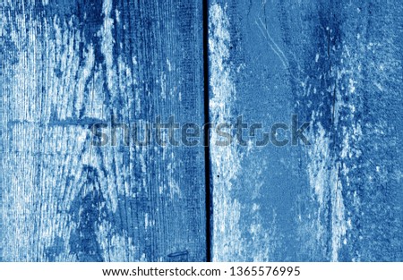Old grungy wooden planks background in navy blue tone. Abstract background and texture for design.