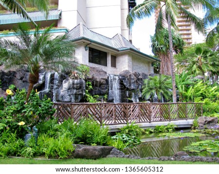 An outside view of a Marriott Resort bridge and waterfalls on the island of Oahu Hawaii