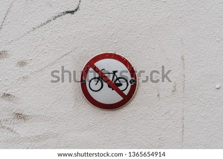 Road sign on wall. No bikes