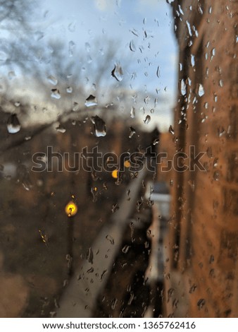 Watermarked window from raindrops on an April day in Chicago