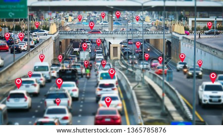 The google map symbol appears on vehicles that use the application map GPS on blurred of the streets in the capital. Traffic jam on the  highway in the rush hour at Bangkok,Thailand.