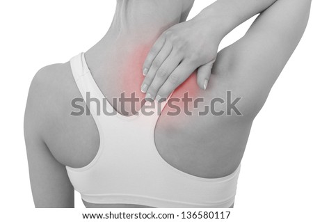 Acute pain in a woman neck. Female holding hand to spot of neck-aches. Concept photo with Color Enhanced skin with read spot indicating location of the pain. Isolation on a white background.