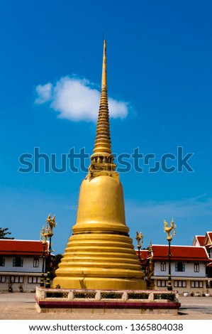 The beautiful and old golden pagoda of the temple  . Samut Sakhon, Thailand