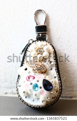 Fashionable metallic key ring for purse isolated on white bachground produce in Chiang Rai Thailand.