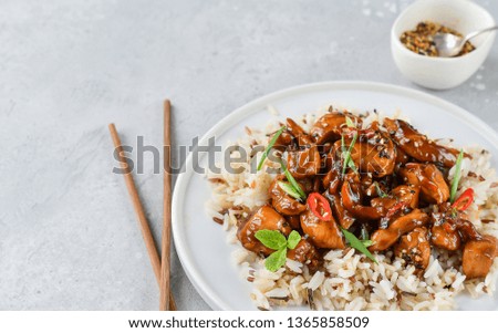 spicy chicken in sweet and sour sauce with chili pepper, Asian cuisine, Chinese cuisine. Thai cuisin. soy sauce. teriyaki chicken's  with  sesame seeds