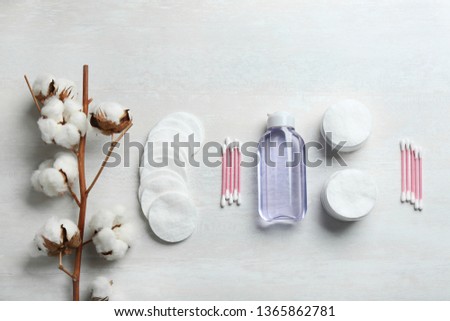 Flat lay composition with cotton hygienic products on light background Royalty-Free Stock Photo #1365862781