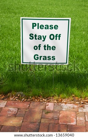 sign requesting others to stay off the freshly planted grass