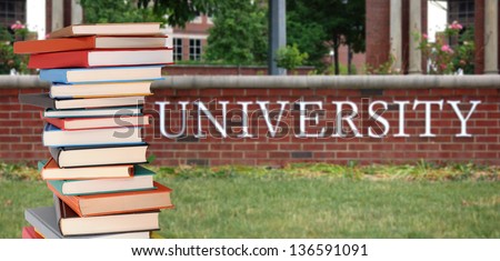 a pile of books in front of university