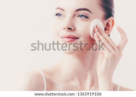 Cotton pads remov makeup woman clean skin face  Royalty-Free Stock Photo #1365919106
