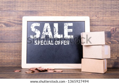 Sale Special Offer concept. Chalk board background on  wooden table