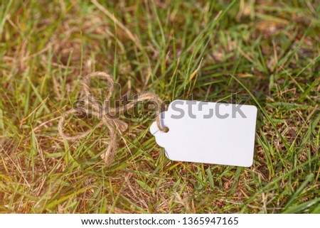 Blank label on grass field background