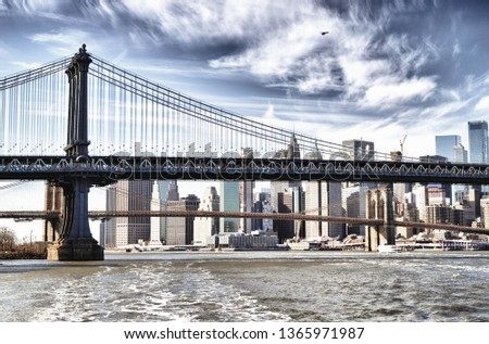 HDR view of Manhattan skyline with Manhattan Bridge and Brooklyn Bridge.