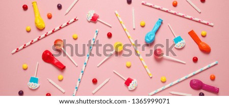 Festive background (pattern) of children's holiday. Cheerful birthday party with sweets on pink background.