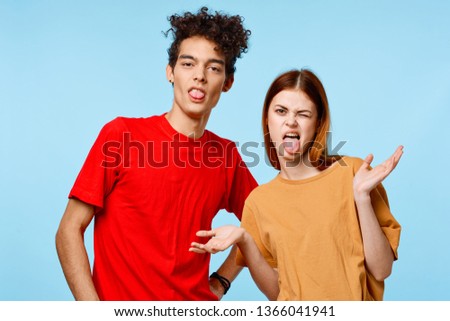 Cheerful nice guy and girl ape blue background