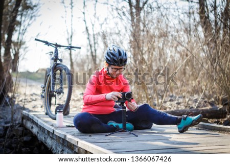 female cyclist blogger tunes steadicam