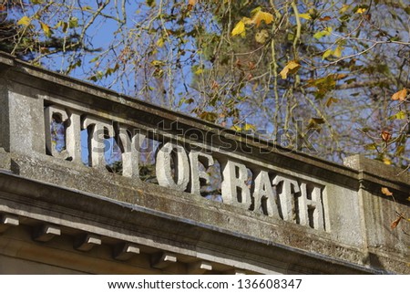 City of Bath sign in stone on top of a building in the botanic gardens in Victoria park, Bath, Somerset, England